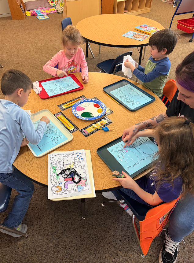 four little kids at their table, fingerprinting seasons