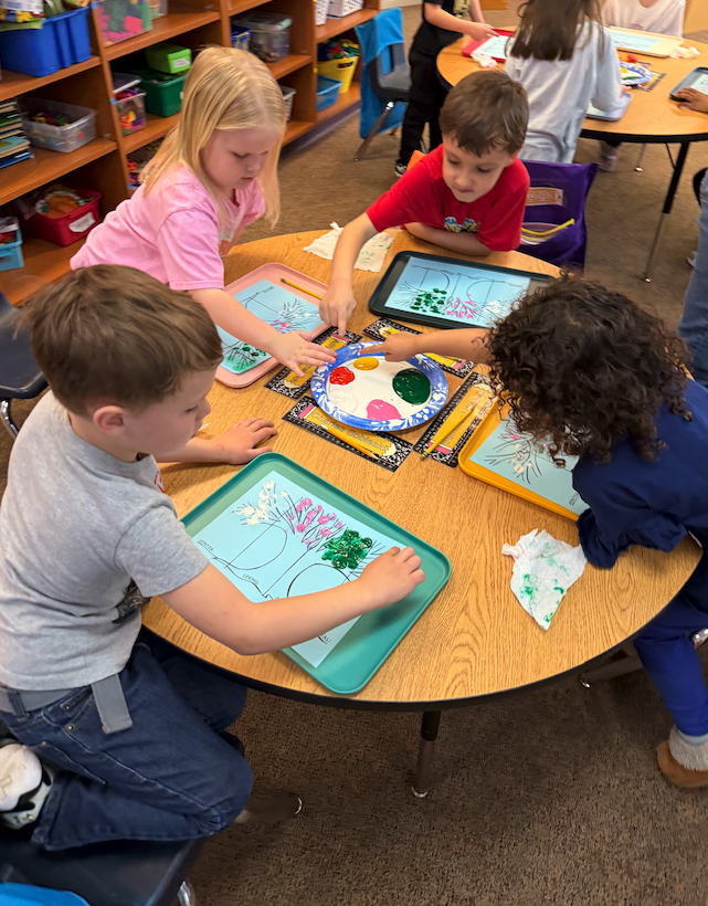 four little kids at their table, fingerprinting seasons