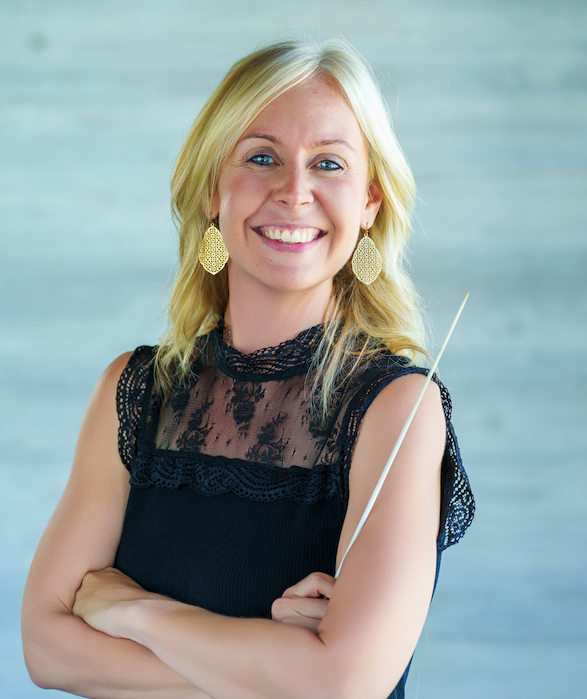 Ruth Livengood, blond woman in black dress with blond hair, holding band baton