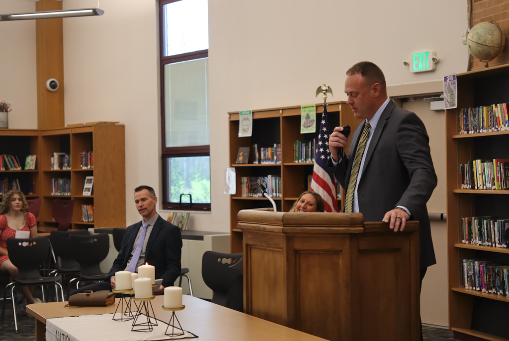 superintendent Travis Walker giving speech at podium