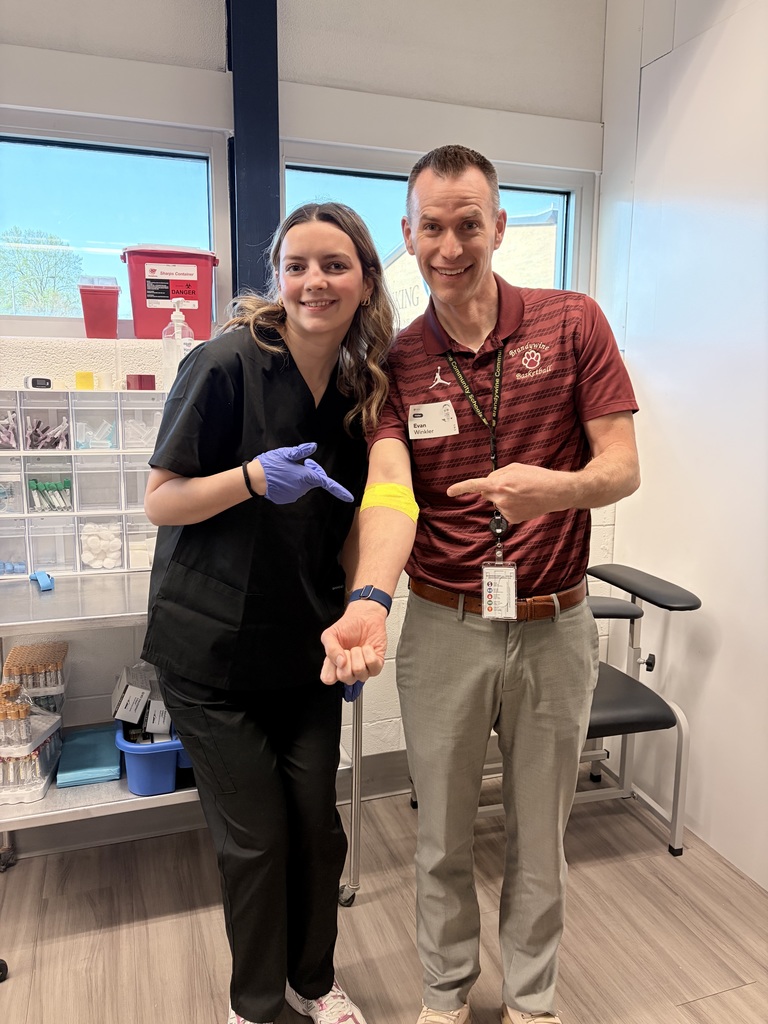 principal Evan Winkler with student who drew his blood