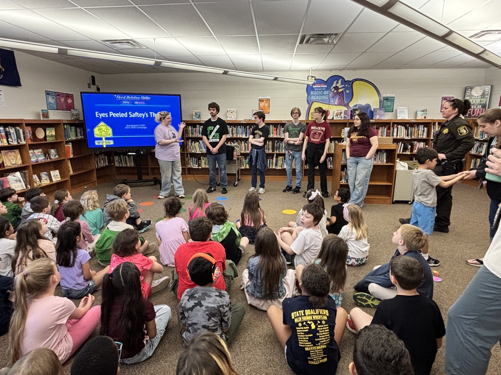 high school kids talking in front of class