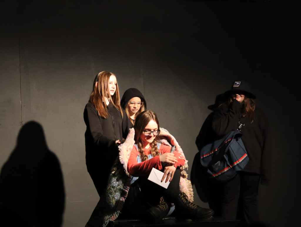 actress sitting on stage