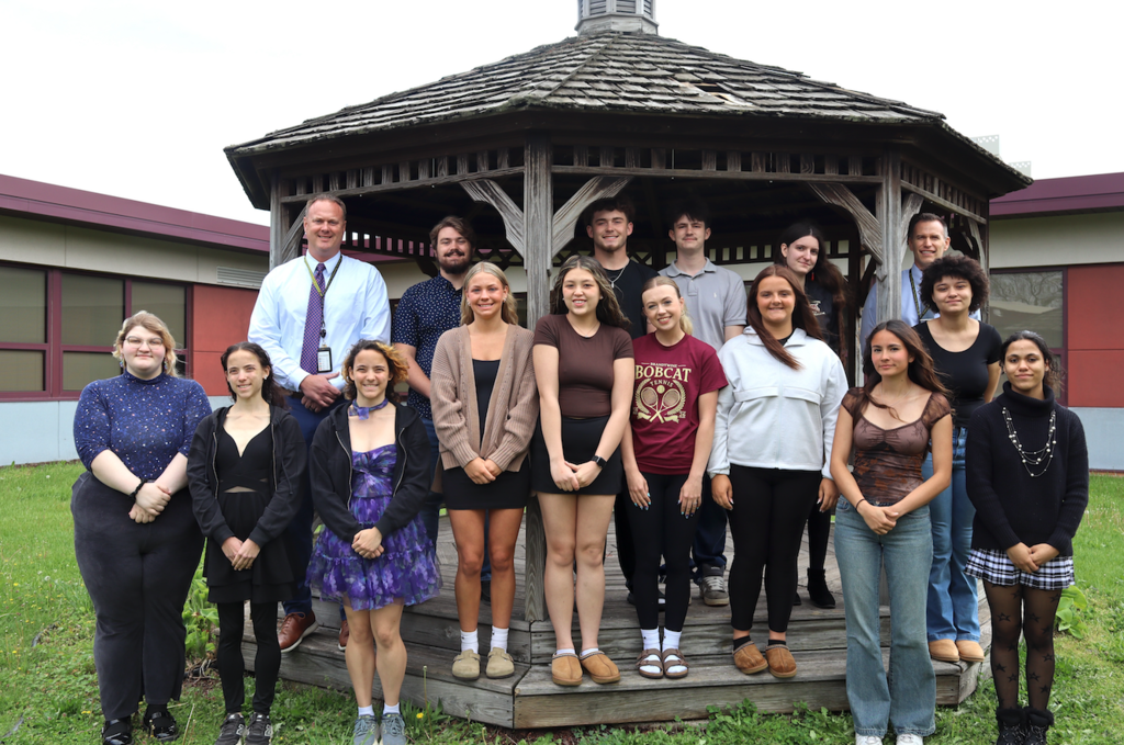 group of 13 students with principal Winkler and superintendent walker