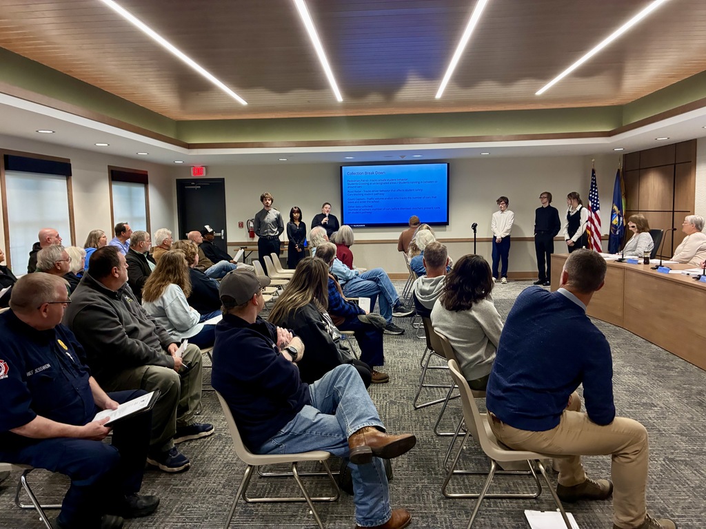 group of students presenting to township board