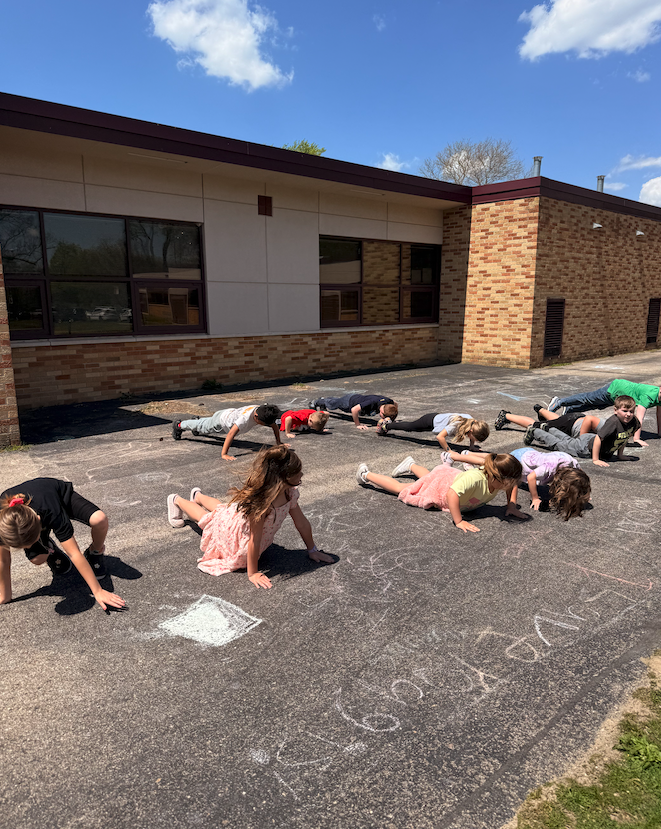 kids on playground doing pushups