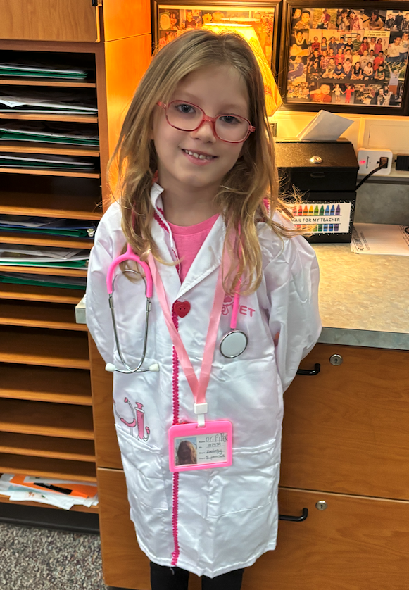 little girl dressed as doctor