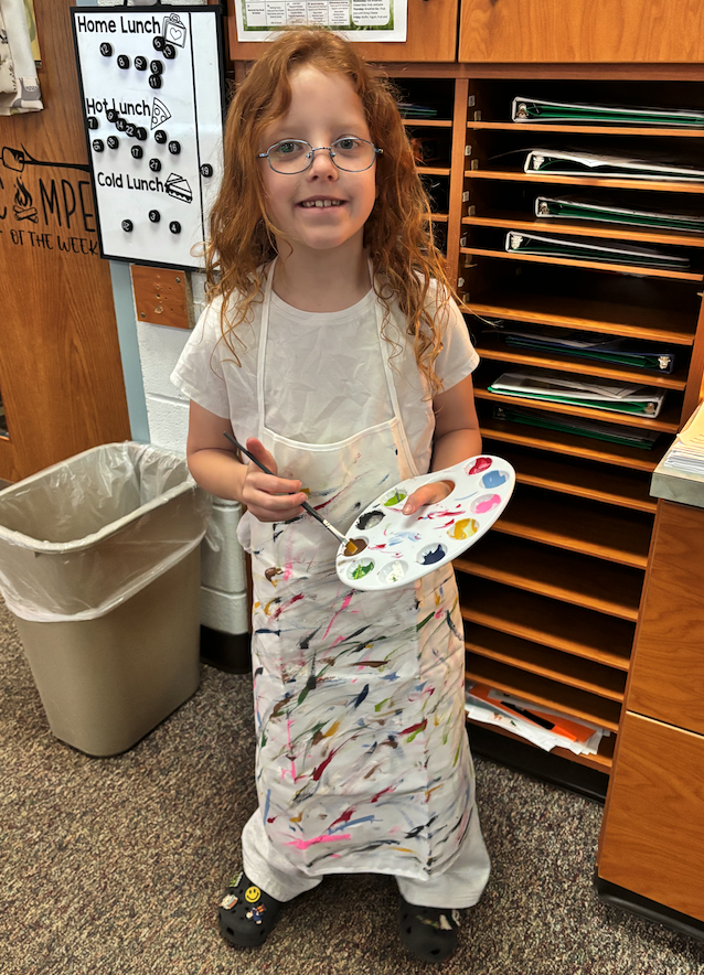 little girl dressed up as artist