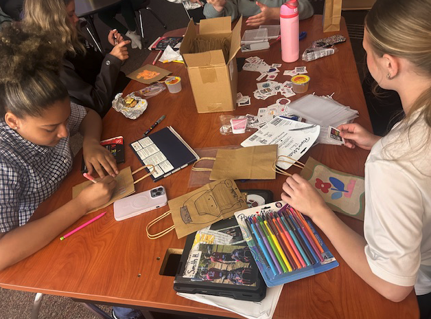 students working on decorating bags