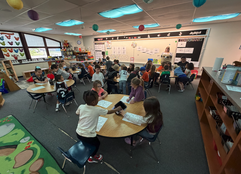 kids sitting at classroom tables