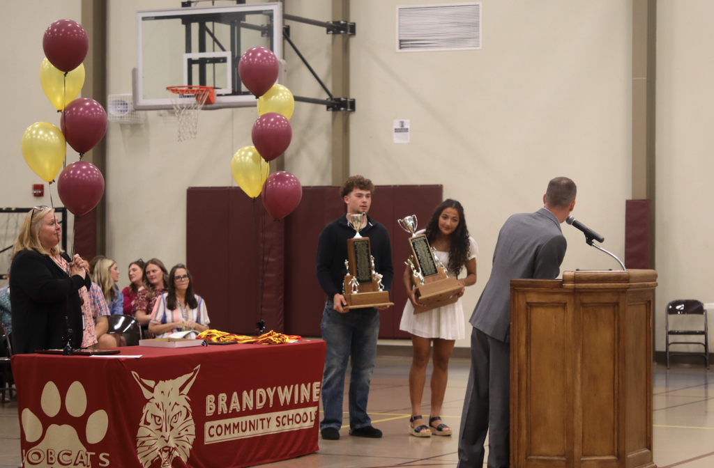 Athletes of the years standing with trophies