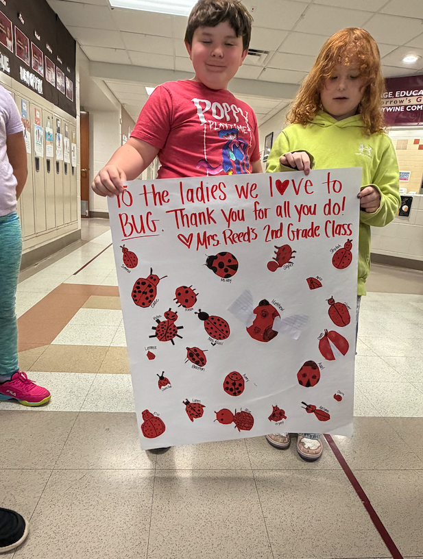 child standing with son with ladybugs on it