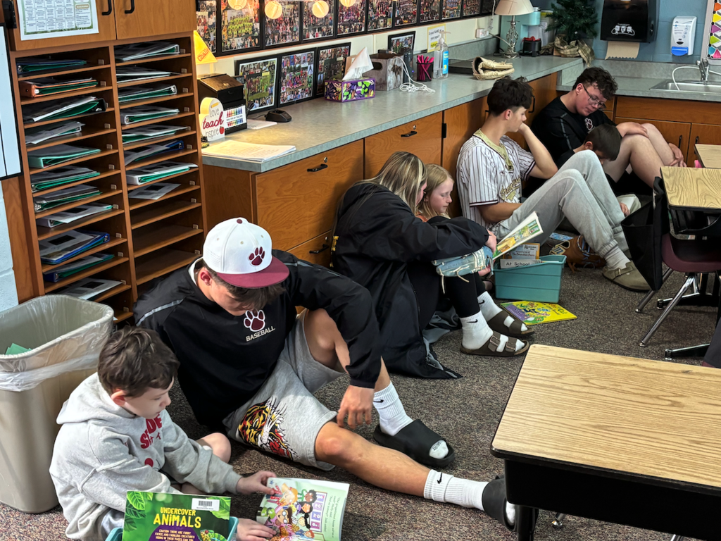 students reading to each other