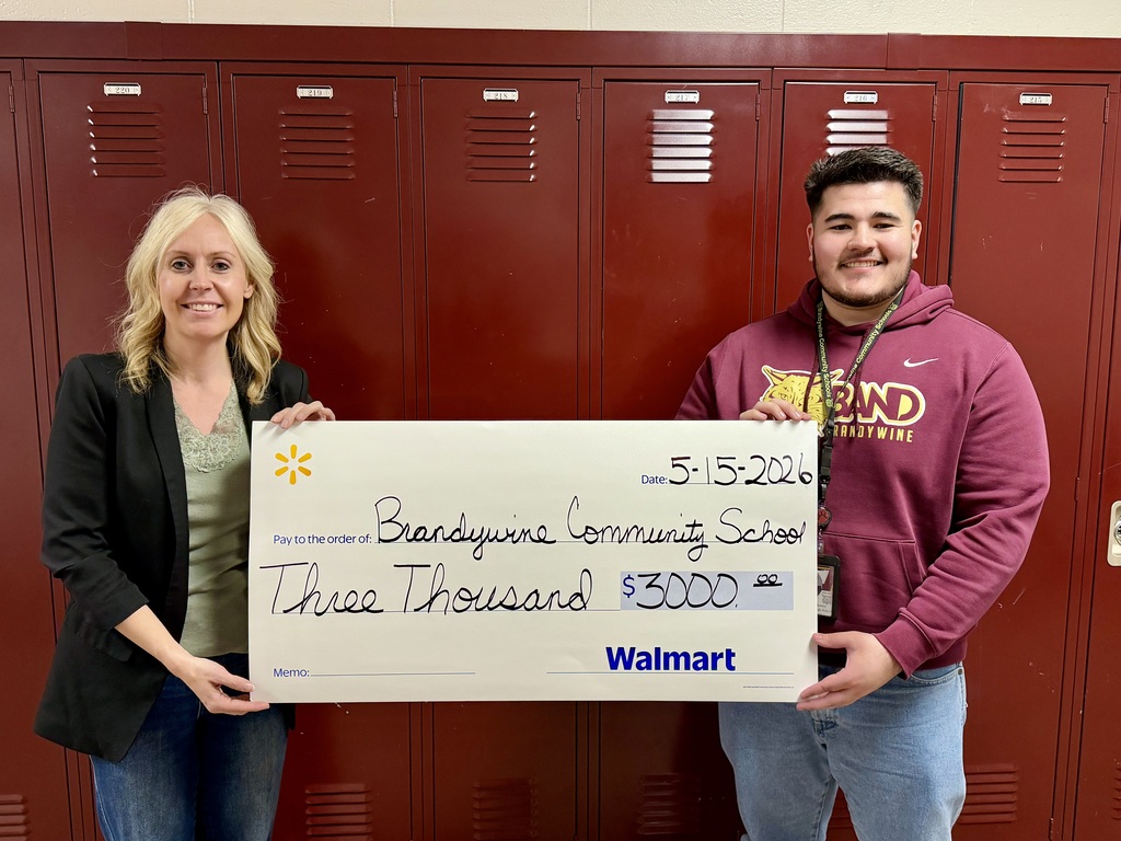 Ruth Livengood and assistant accepting $3,000 check from Walmart