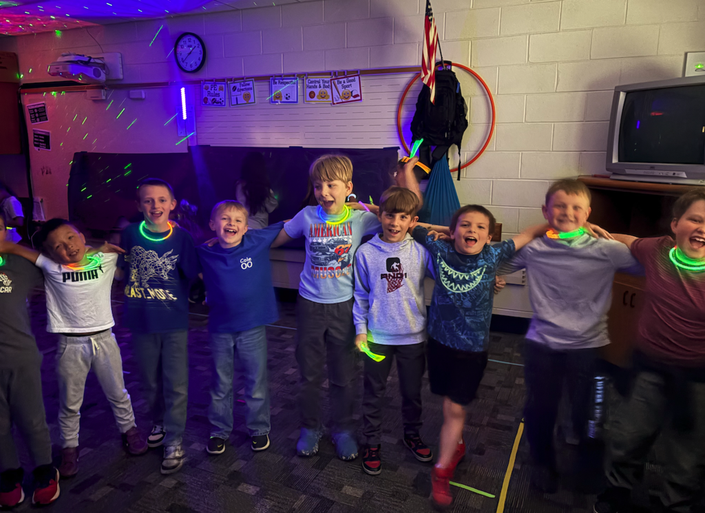 ground of kids wearing glow sticks