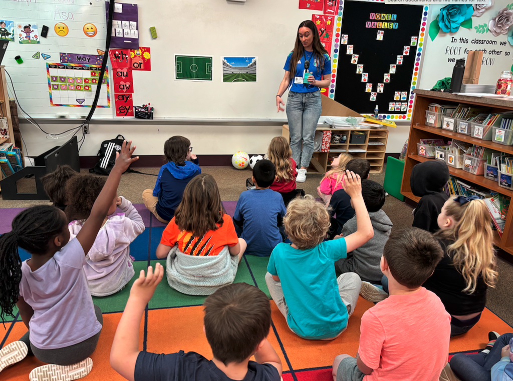 students in classroom listening to presenter 