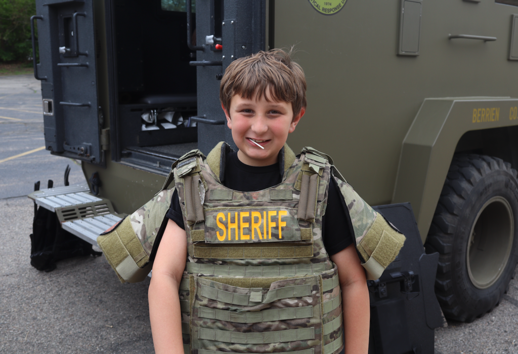 kid dressed in sherriff outfit
