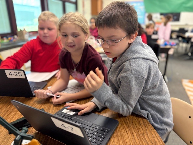 students working on a computer