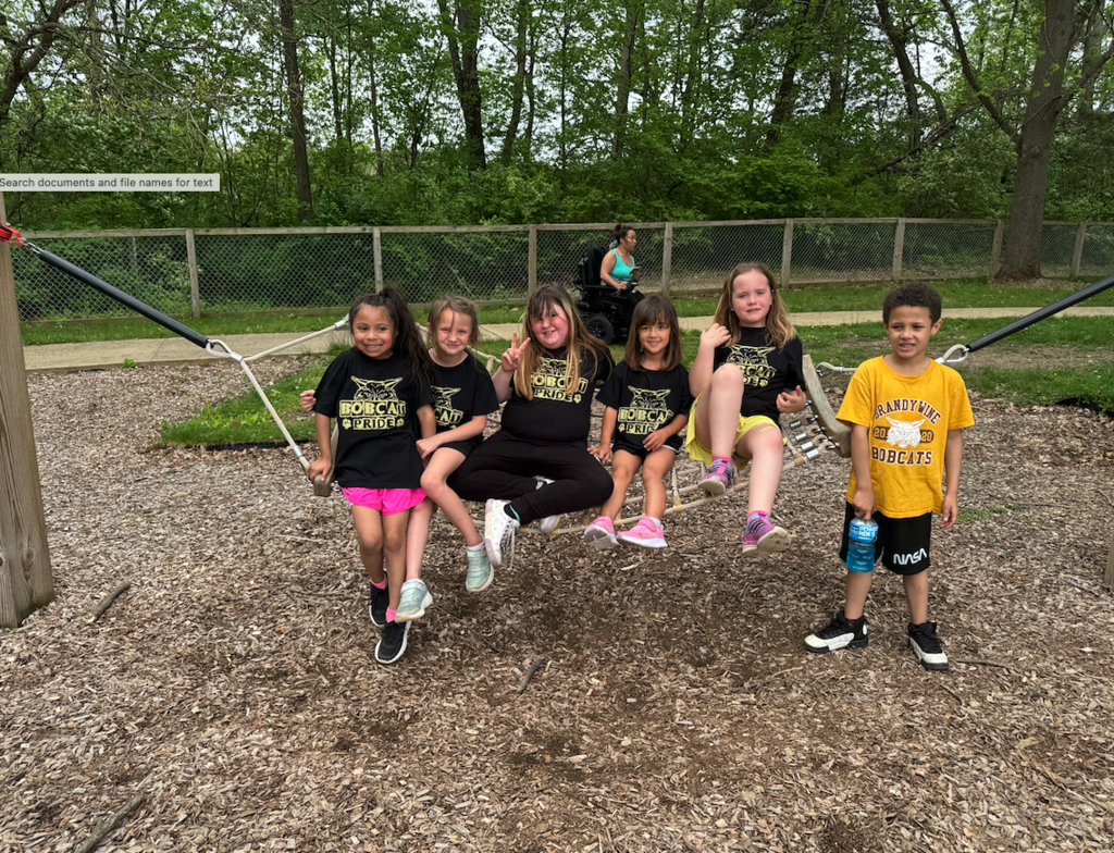 group of kiddos on hammock at the zoo