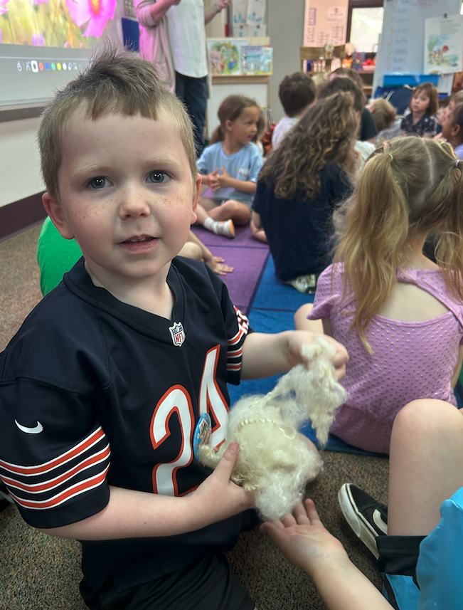 student holding wool