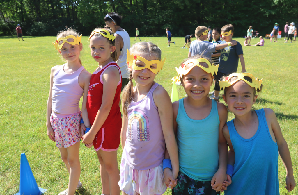 group of five girls holding hands for relay races