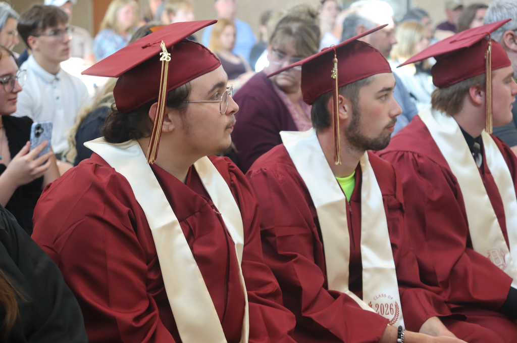 graduates sitting in chairs
