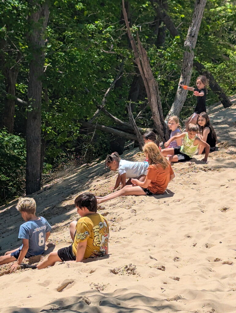 kids sitting on the beach