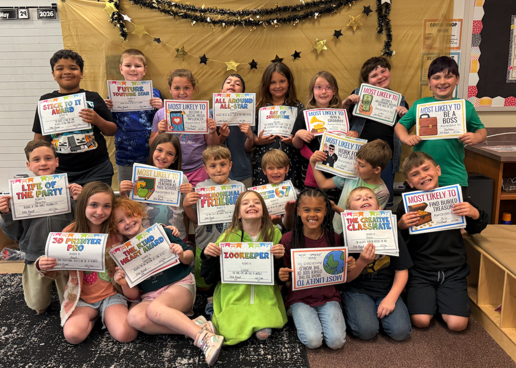 Mrs. Reed's class, holding certificates for awards 