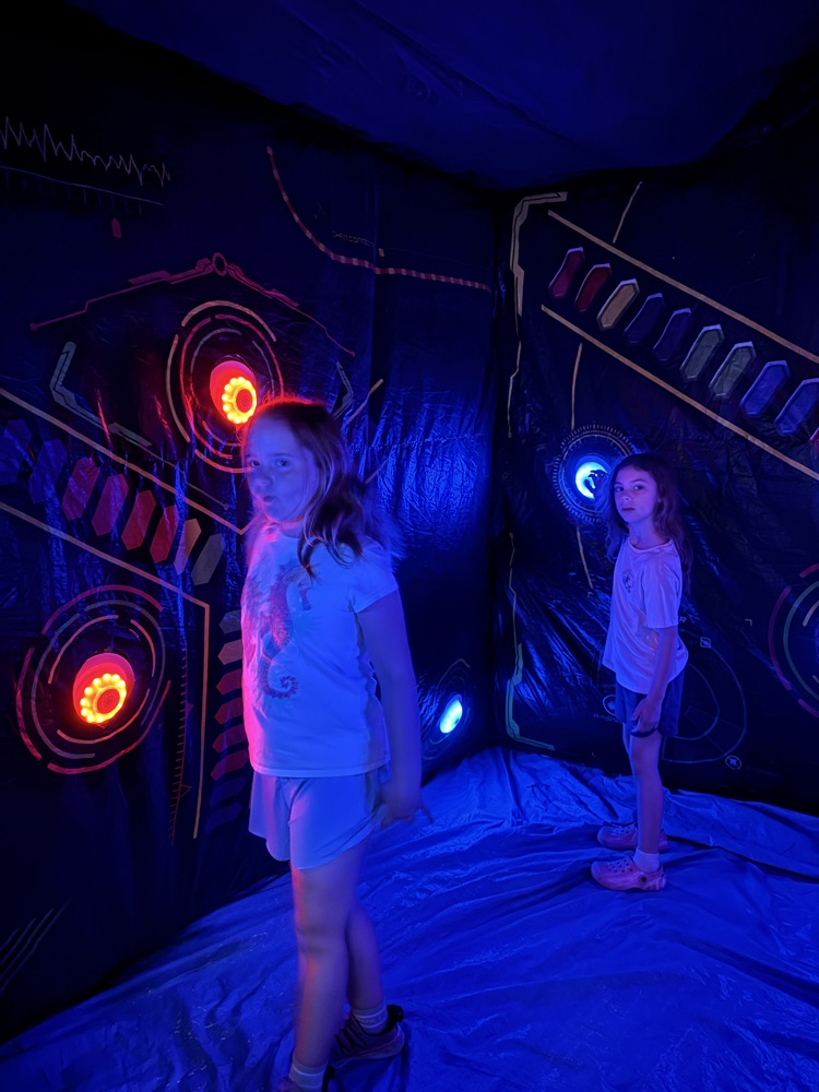 kid in black light room