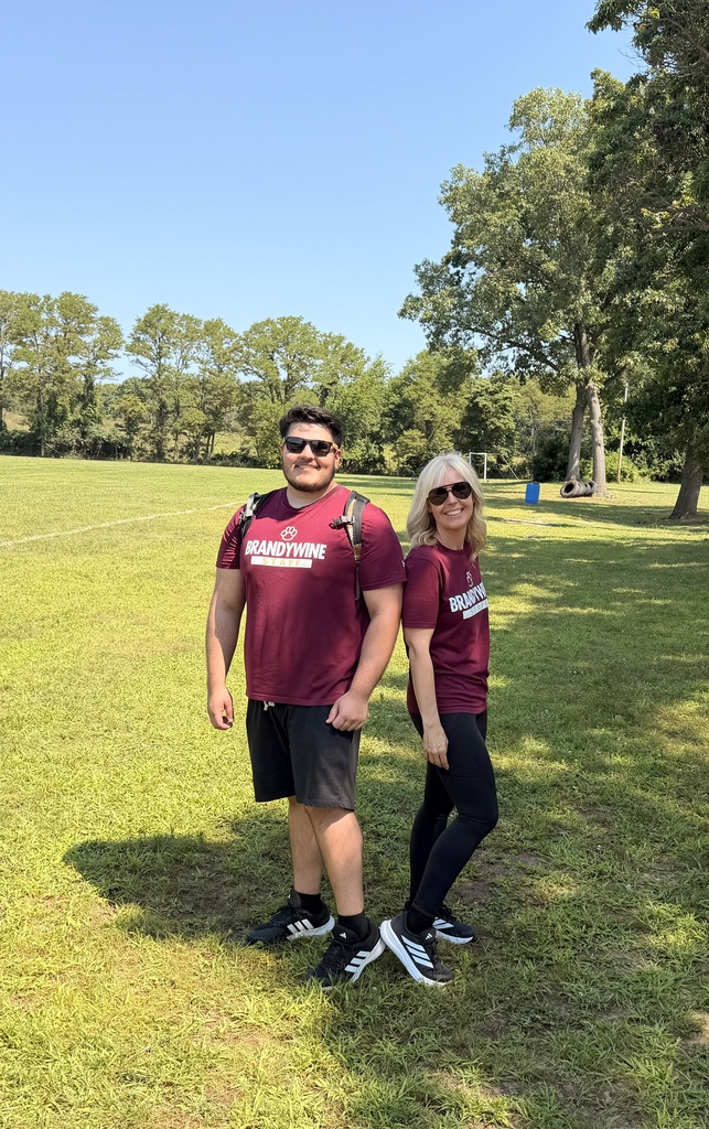 luis and ruth standing on the field