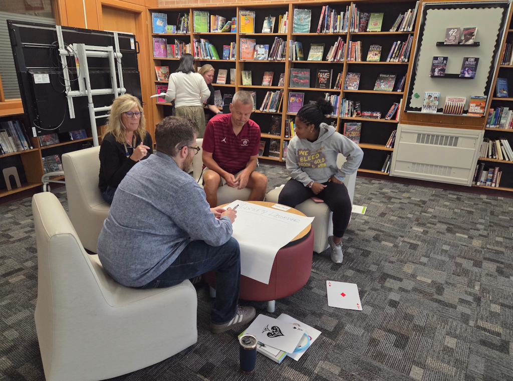 group of teachers discussing 