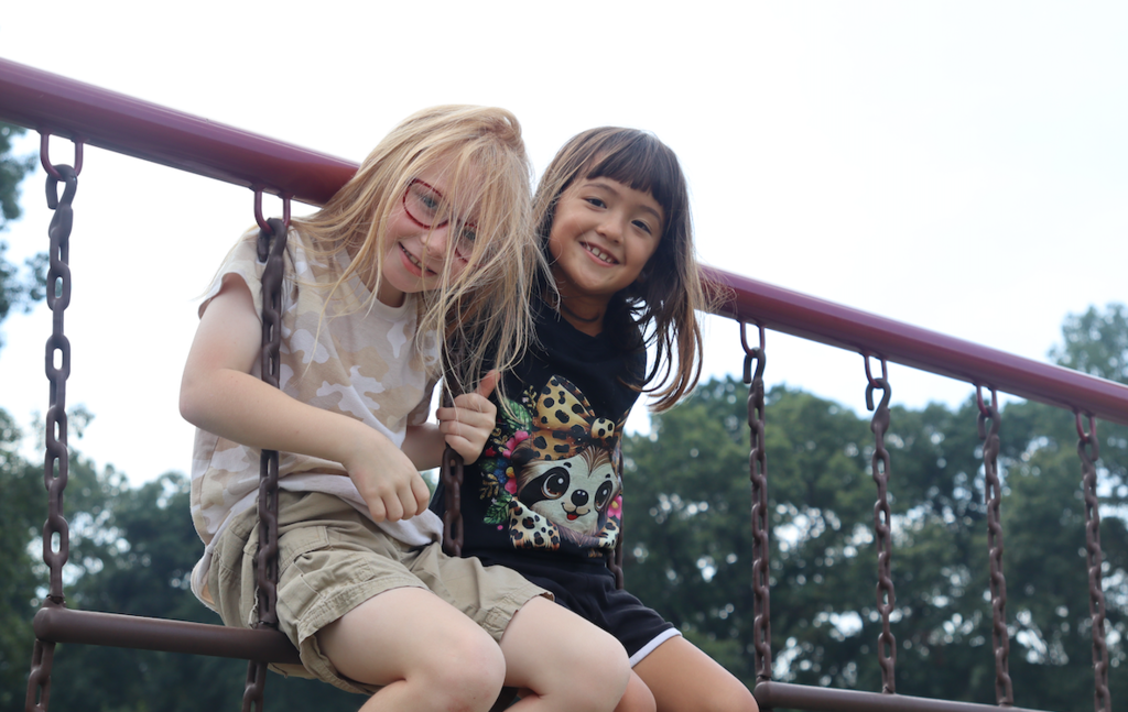 two girls playing in the playground
