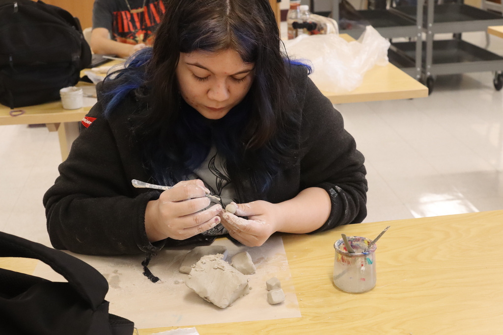 student doing art project