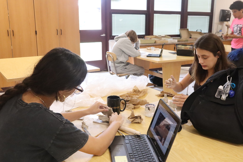 student doing art project