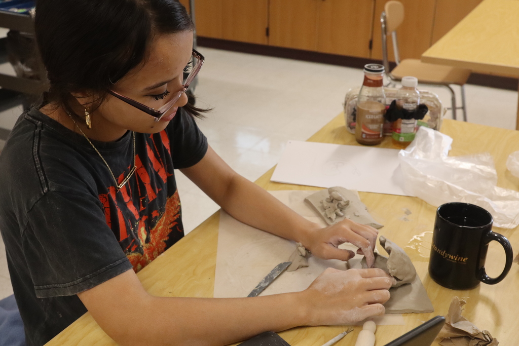 student doing art project