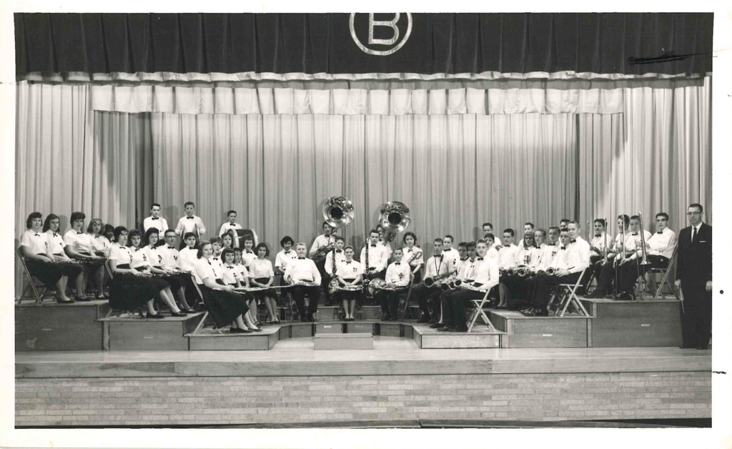 band from olden days sitting on stage