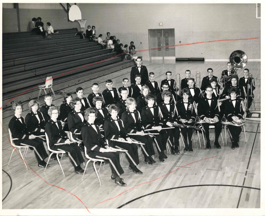 band sitting on gym floor