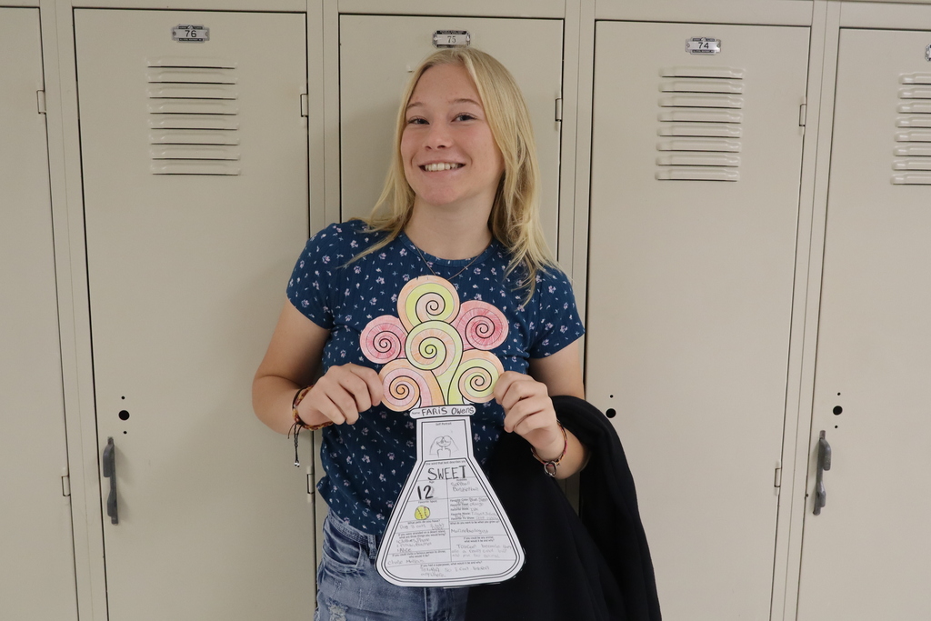 student with science flask with about her facts