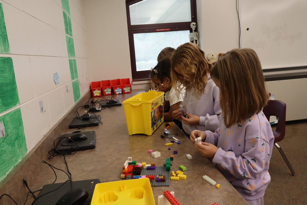 group of girls working on legos