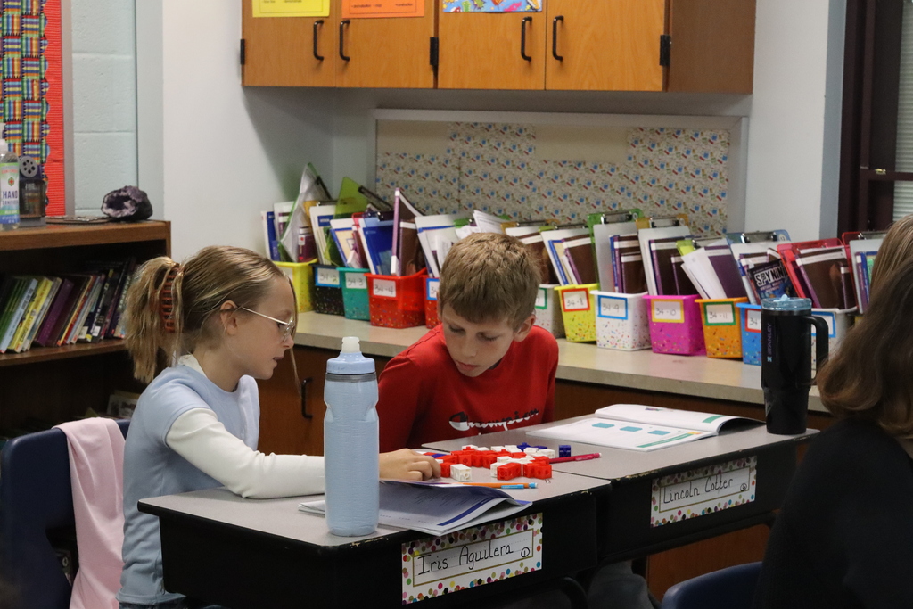 young boy and girl working with blocks