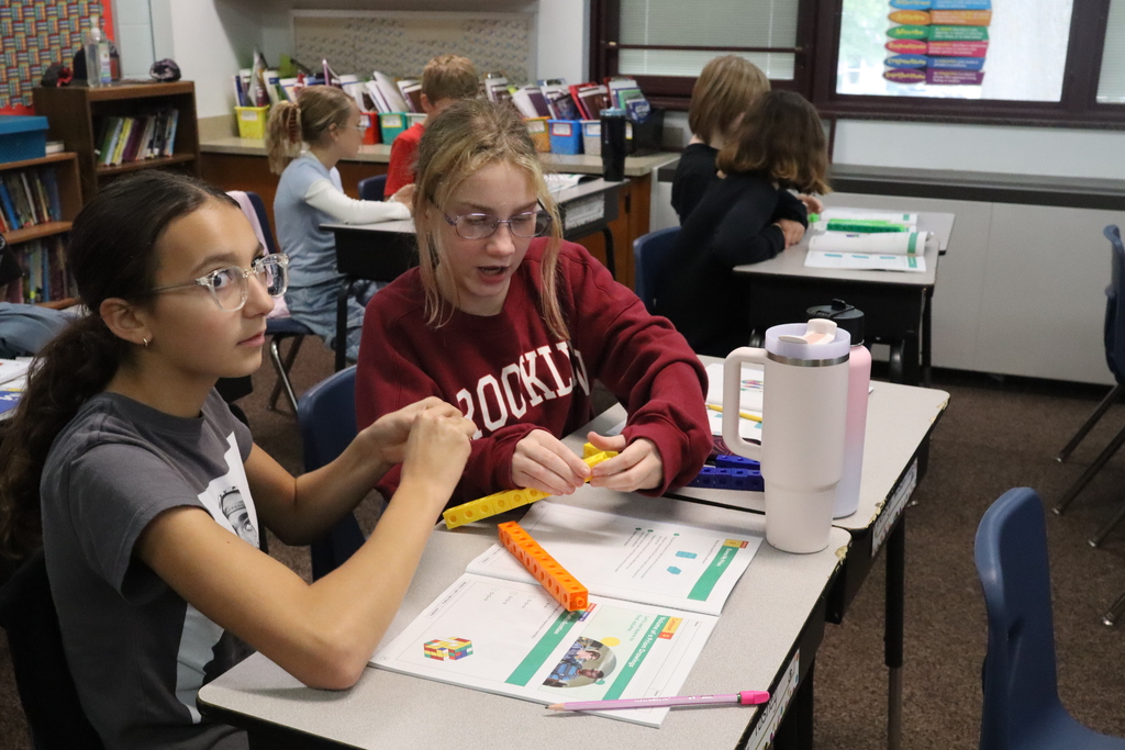 two girls working on cubes