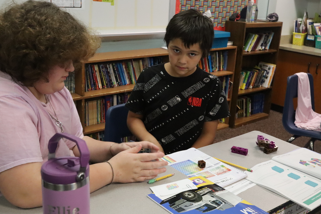 young boy and girl working with blocks
