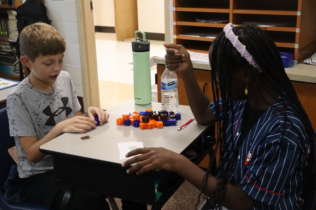 young girls and boy working with blocks