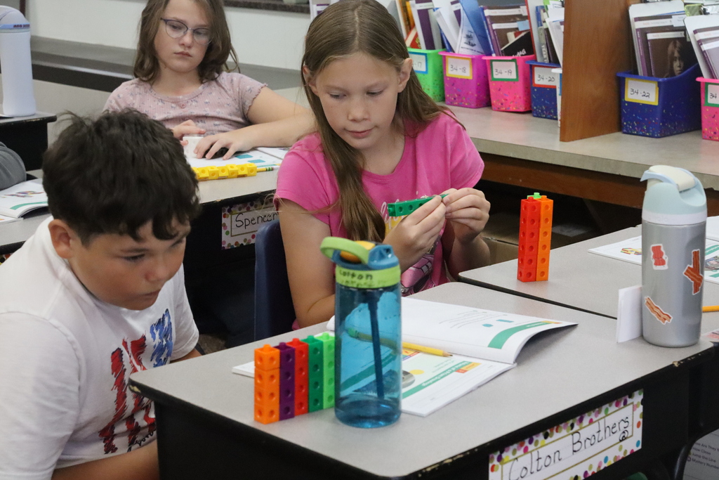 young boy and girl working on blocks