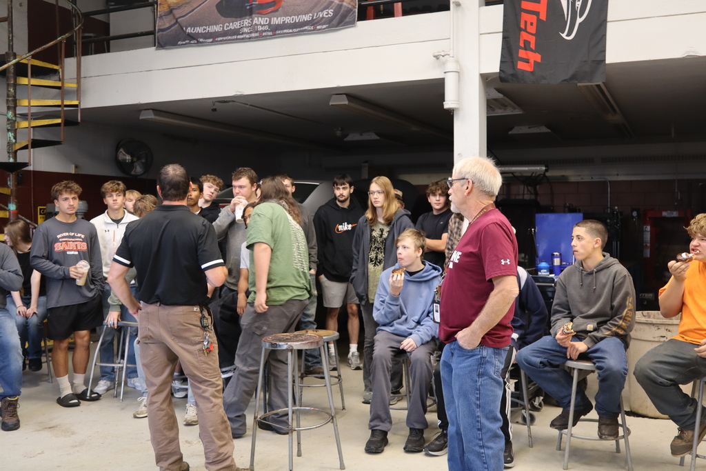 group of kids listening to CTE teacher
