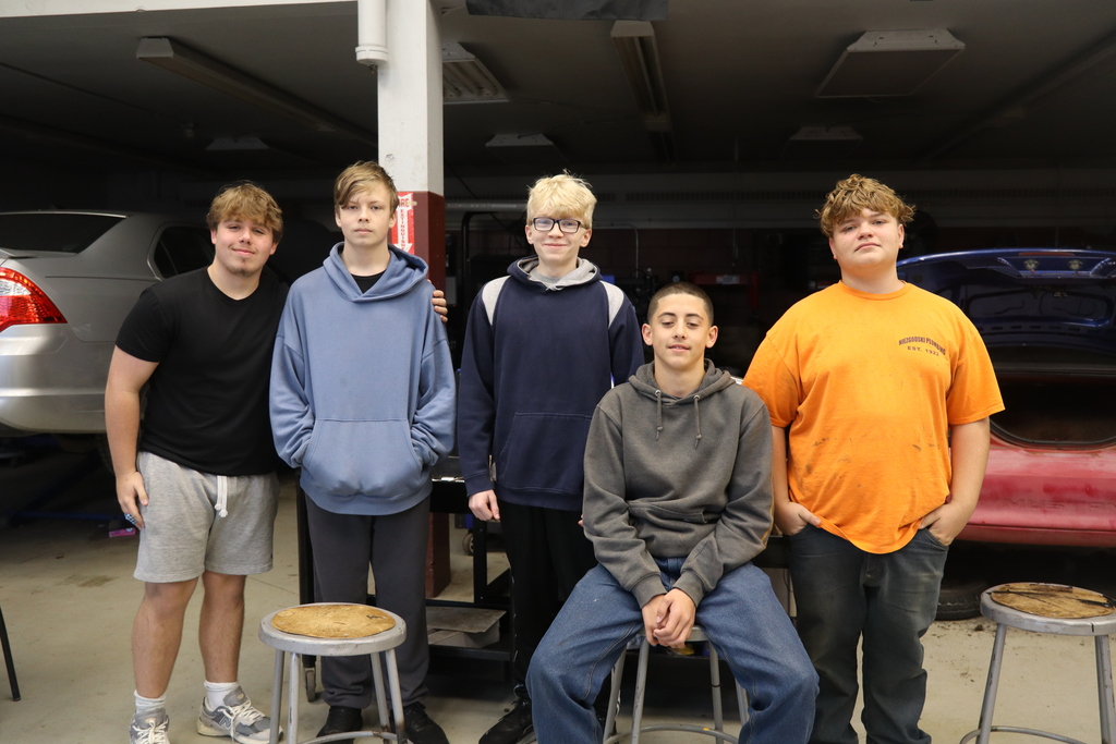 five boys in auto shop