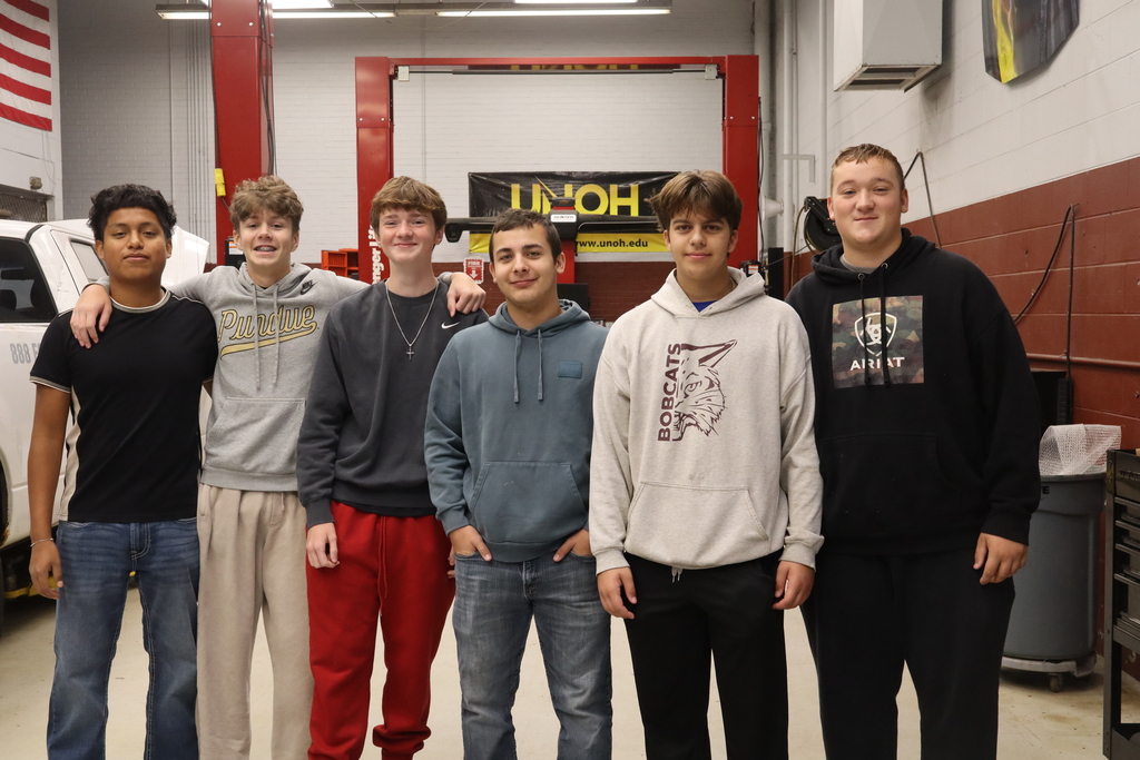 six boys in auto shop