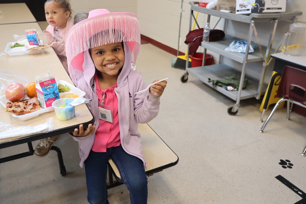 little girl dressed up in pink outfit