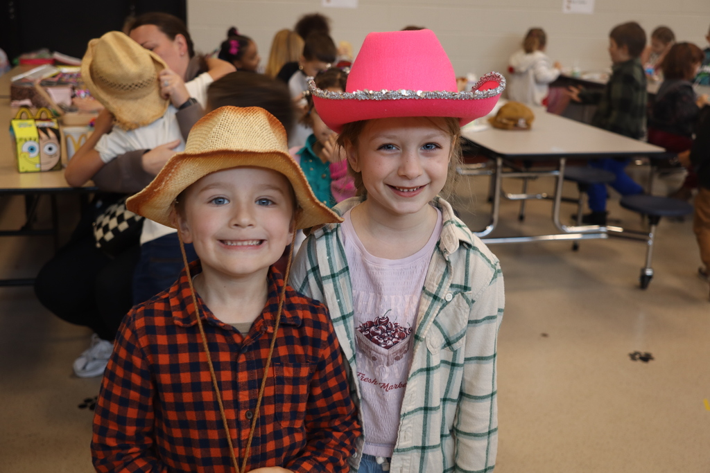 a young boy and girl dressed up for dolly parton day