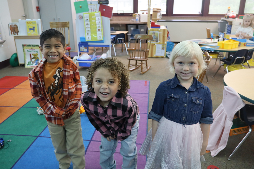 two girls and a boy dressed up for dolly parton day